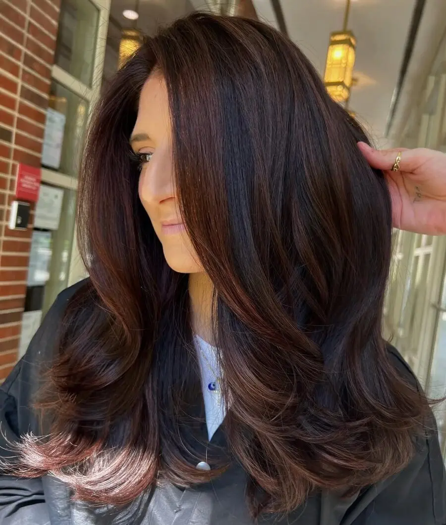 Gorgeous voluminous chocolate cherry hairstyle