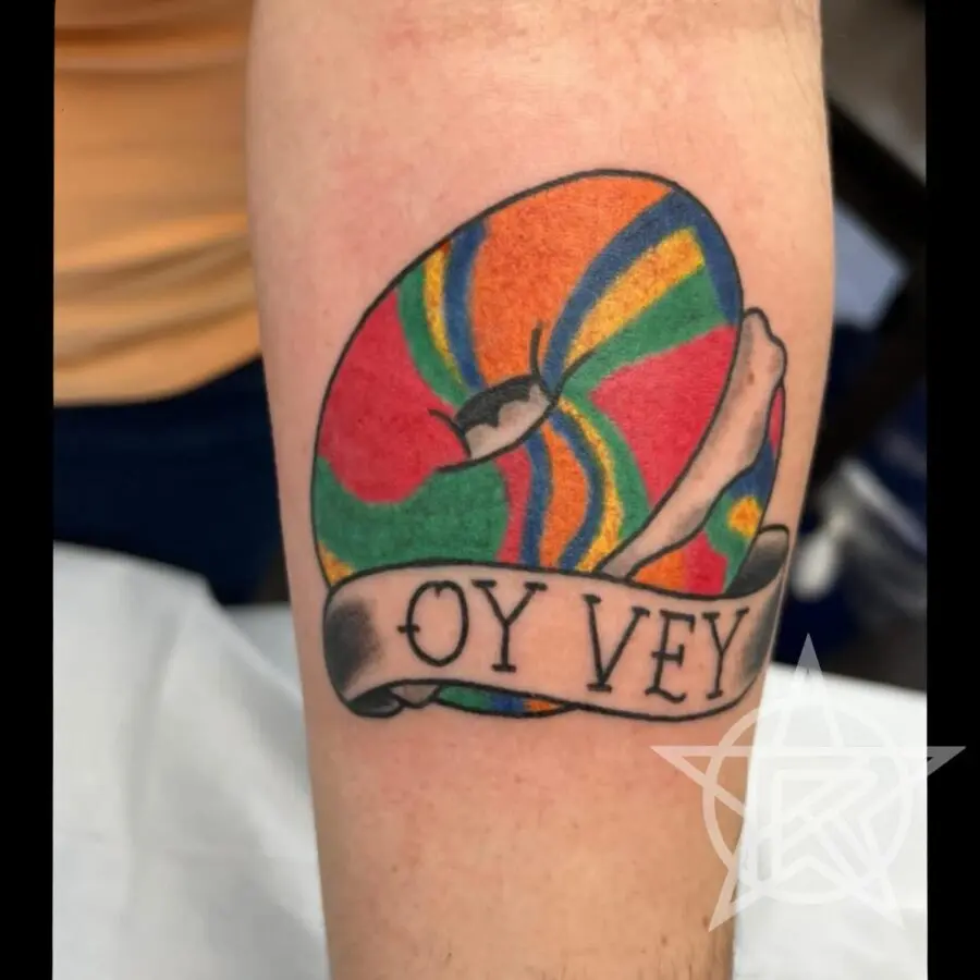 Playful bagel tattoo with vibrant colors