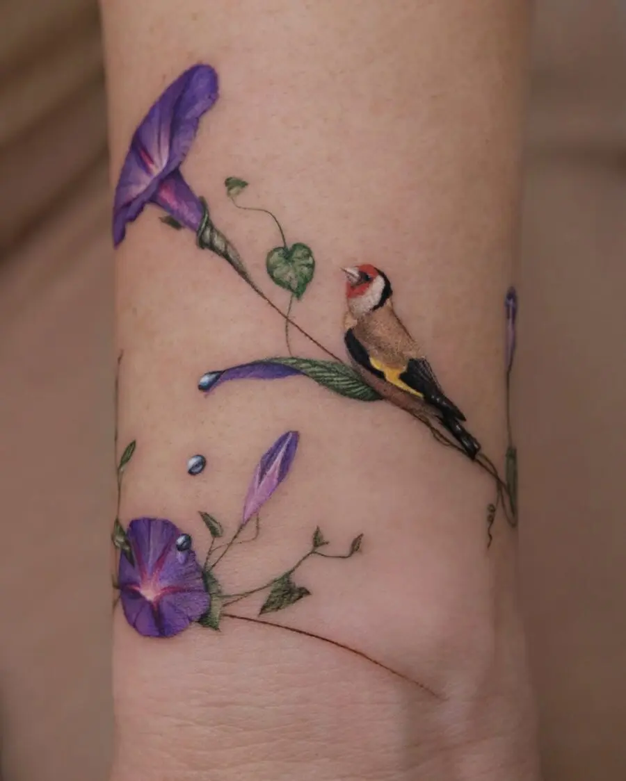 Vibrant floral and bird tattoo design