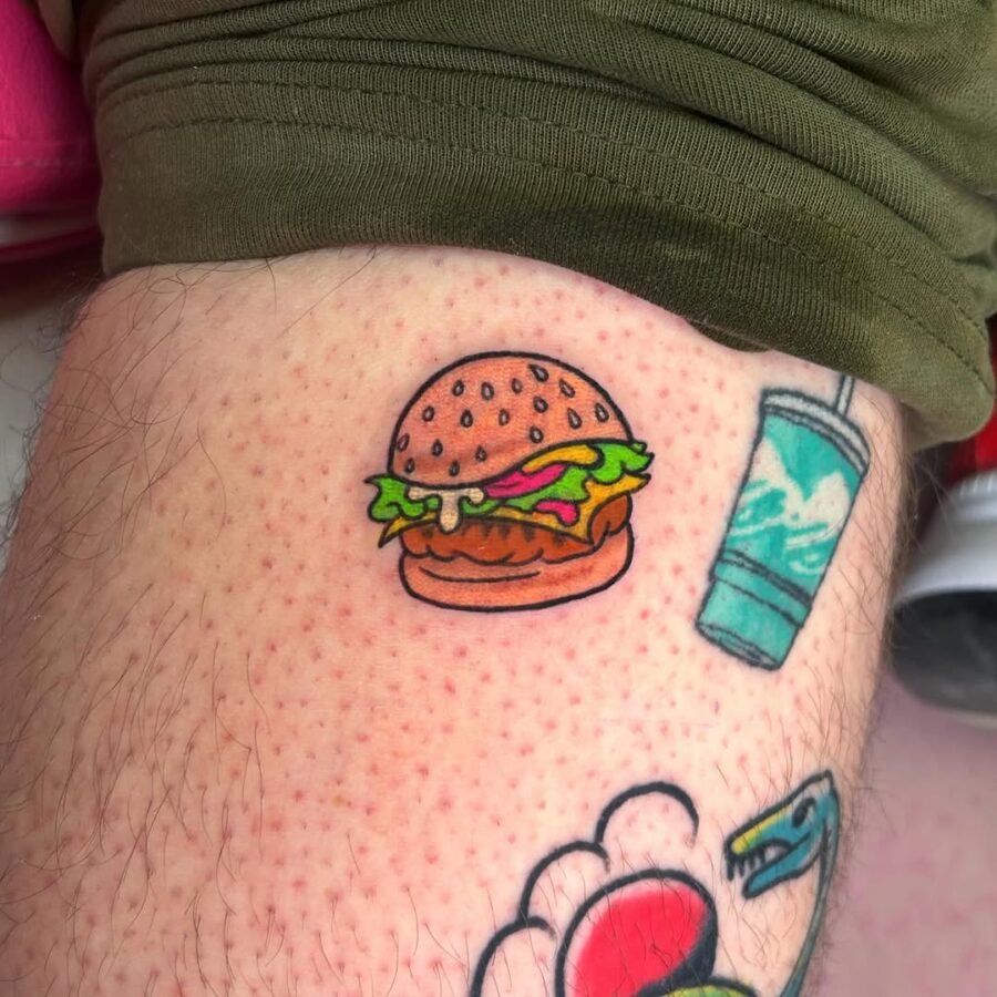 Playful burger tattoo brings joy to ink.