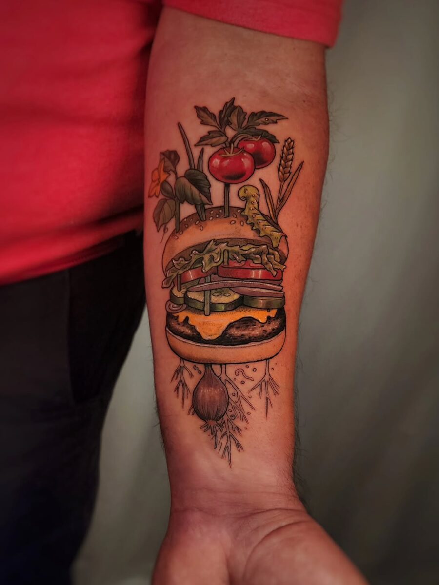 Vibrant burger tattoo with fresh produce elements