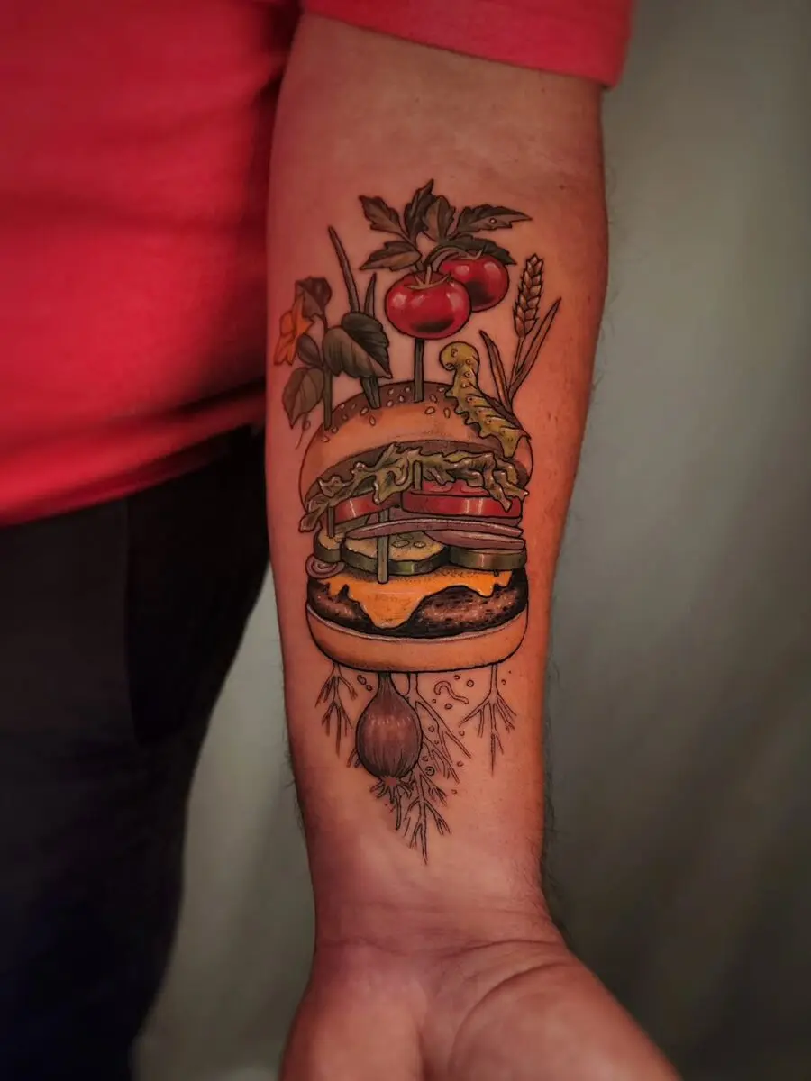 Vibrant burger tattoo with fresh produce elements
