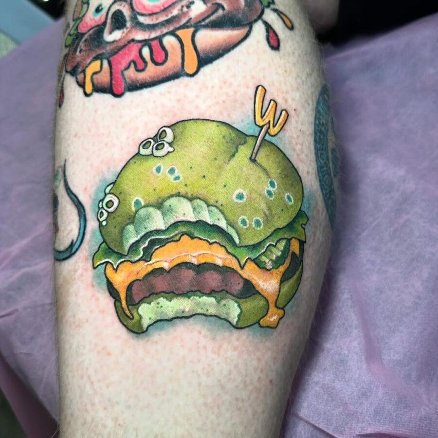 Vibrant cartoon burger tattoo with playful details