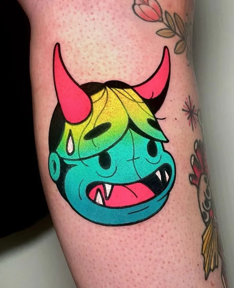 Vibrant cartoon monster tattoo with playful vibes
