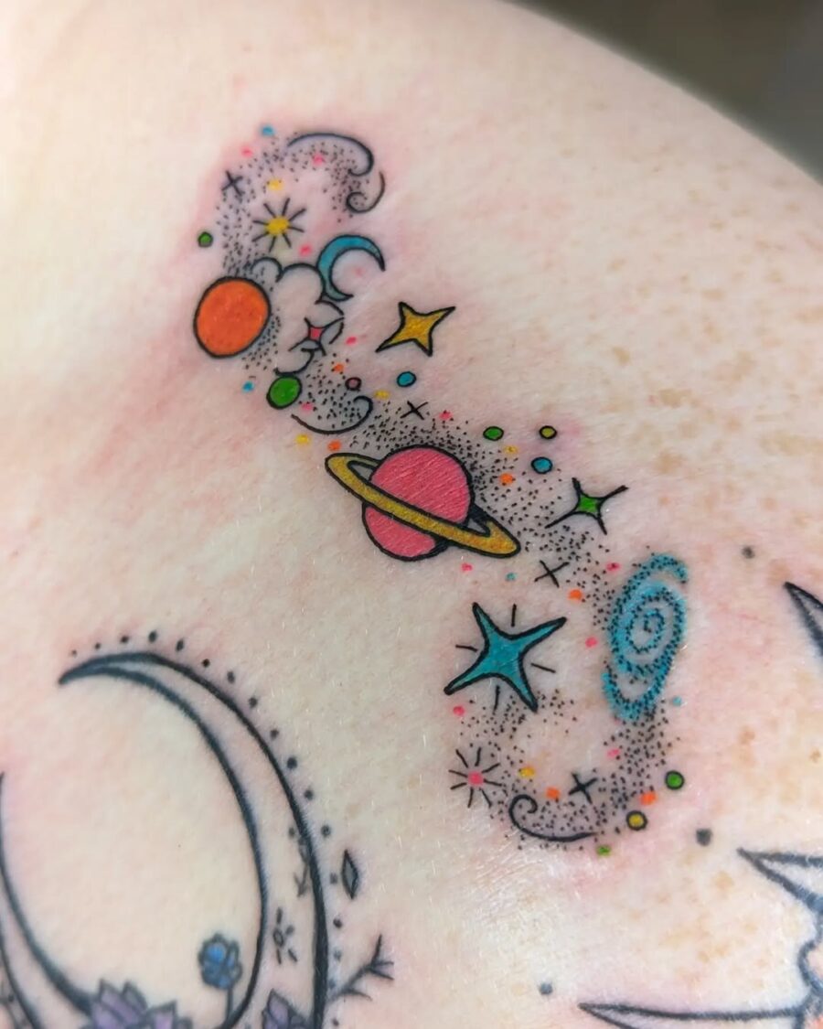 Vibrant celestial tattoo with planets and stars