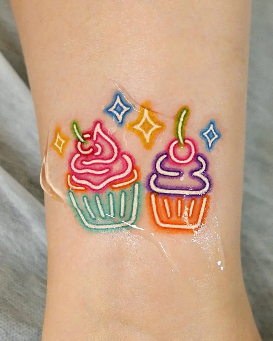 Delightful dual cupcake tattoo design