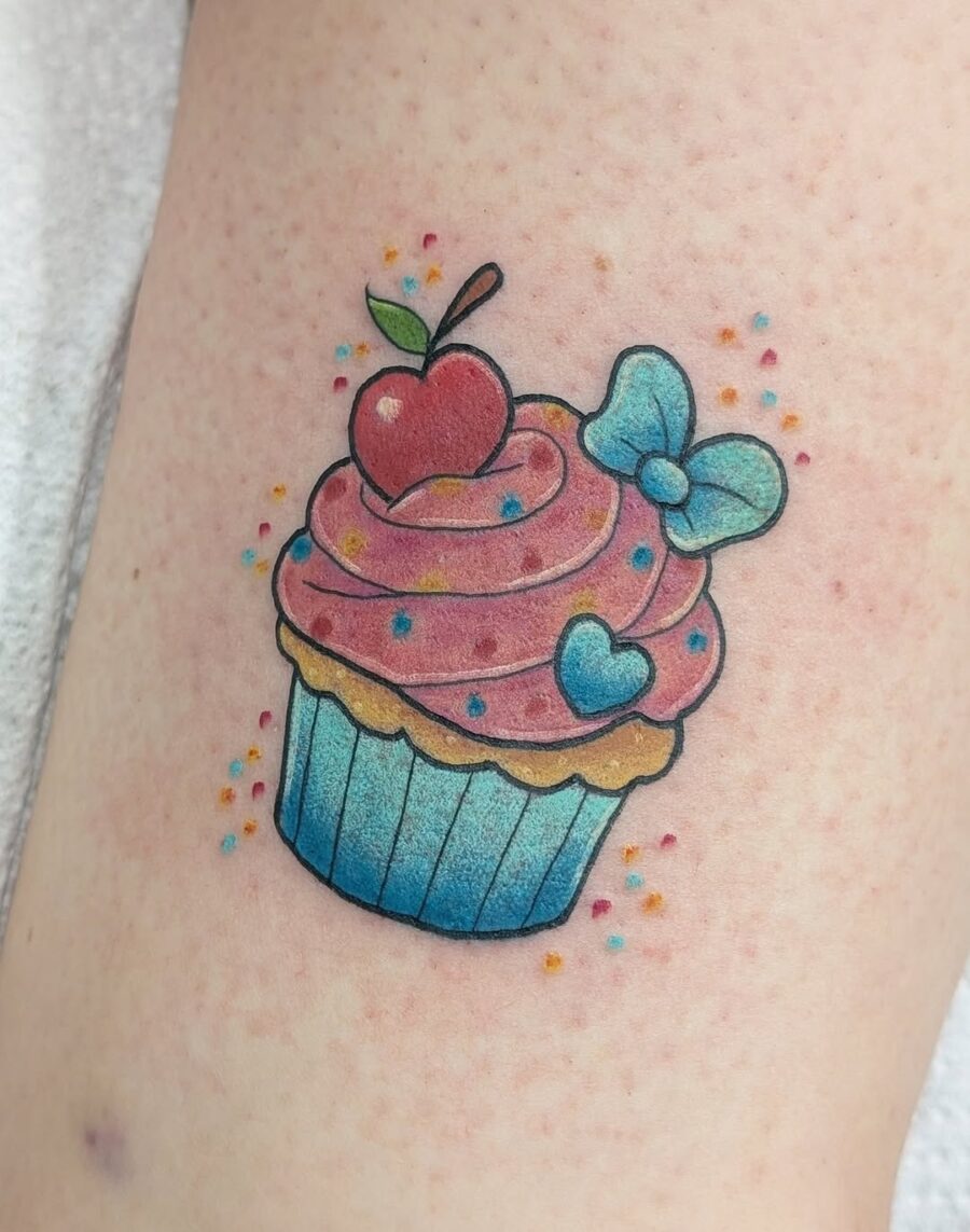 Vibrant cupcake tattoo with playful details