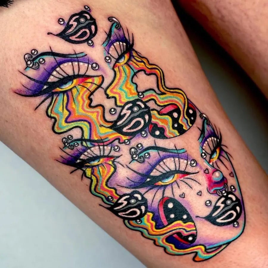 Strikingly vibrant dual-faced tattoo design