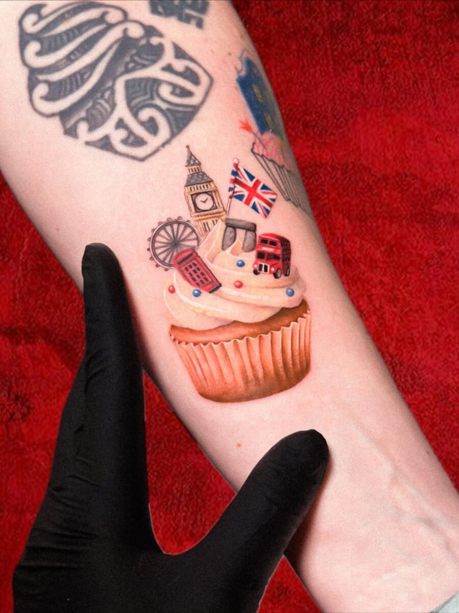 Charming cupcake tattoo with London landmarks