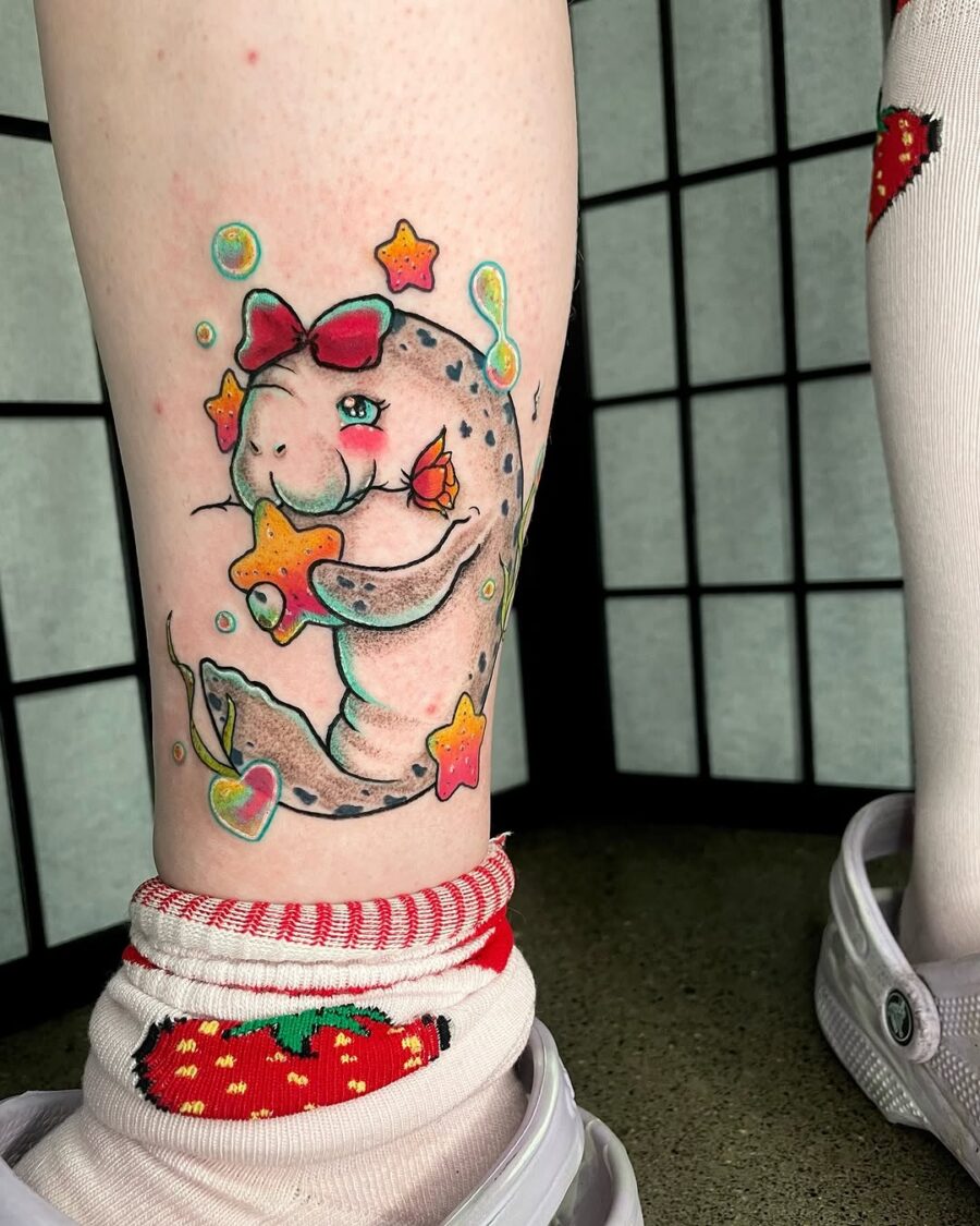 Charming manatee tattoo with playful stars