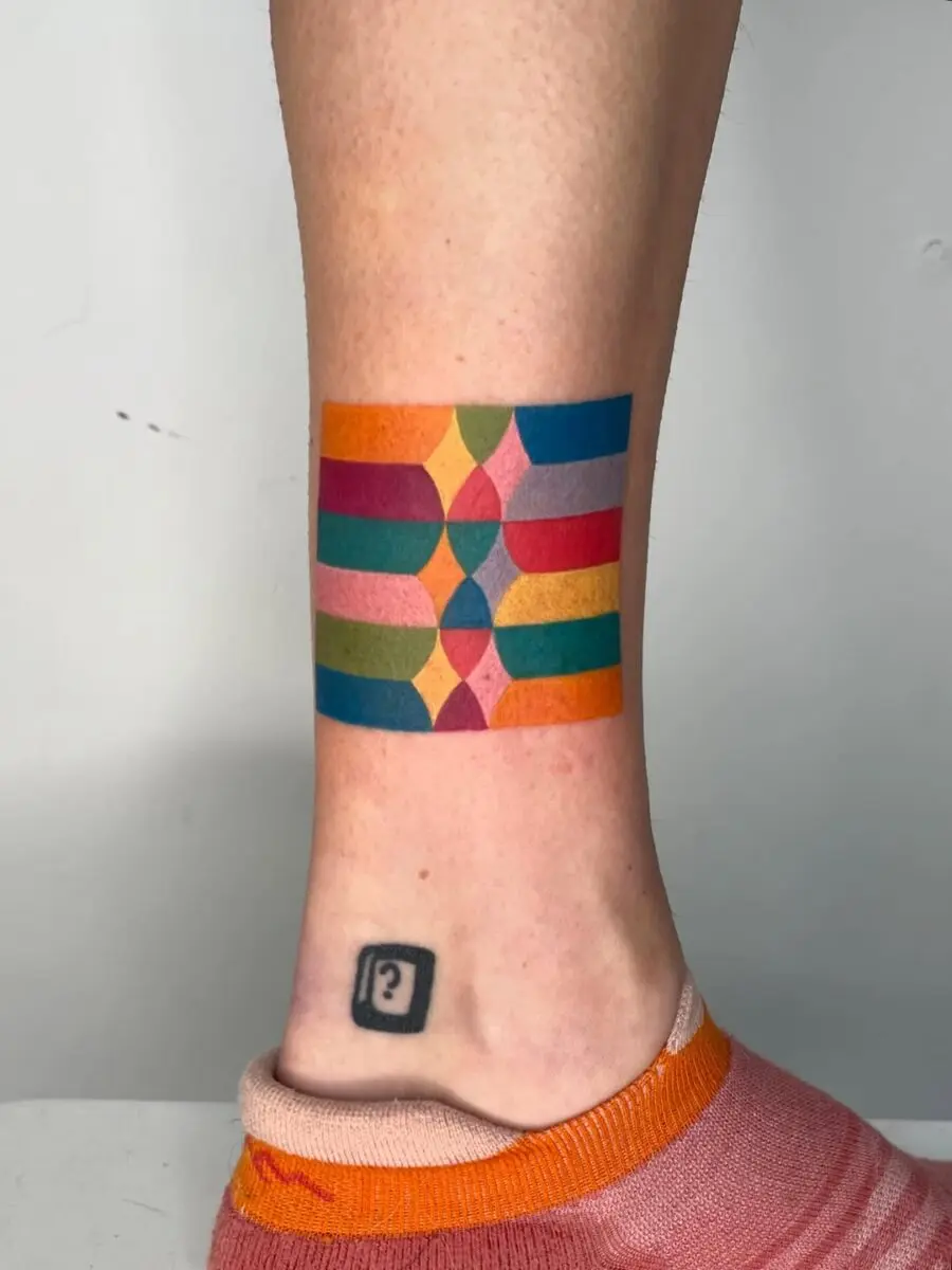Vibrant geometric patterns in new school tattoos