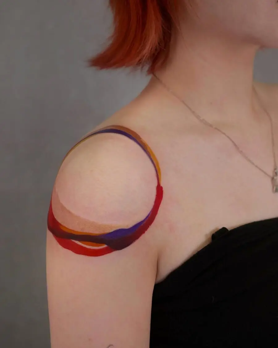 Vibrant and flowing shoulder tattoo design
