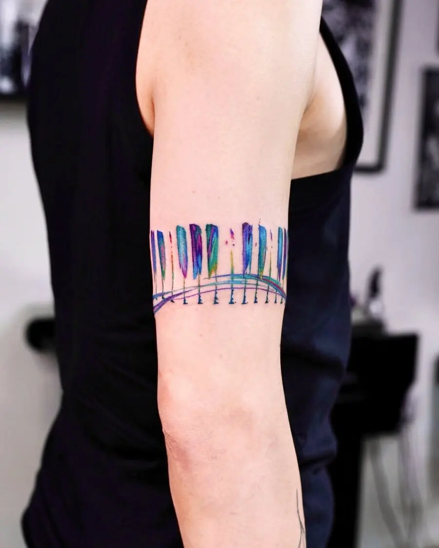 Colorful piano keys tattoo on arm