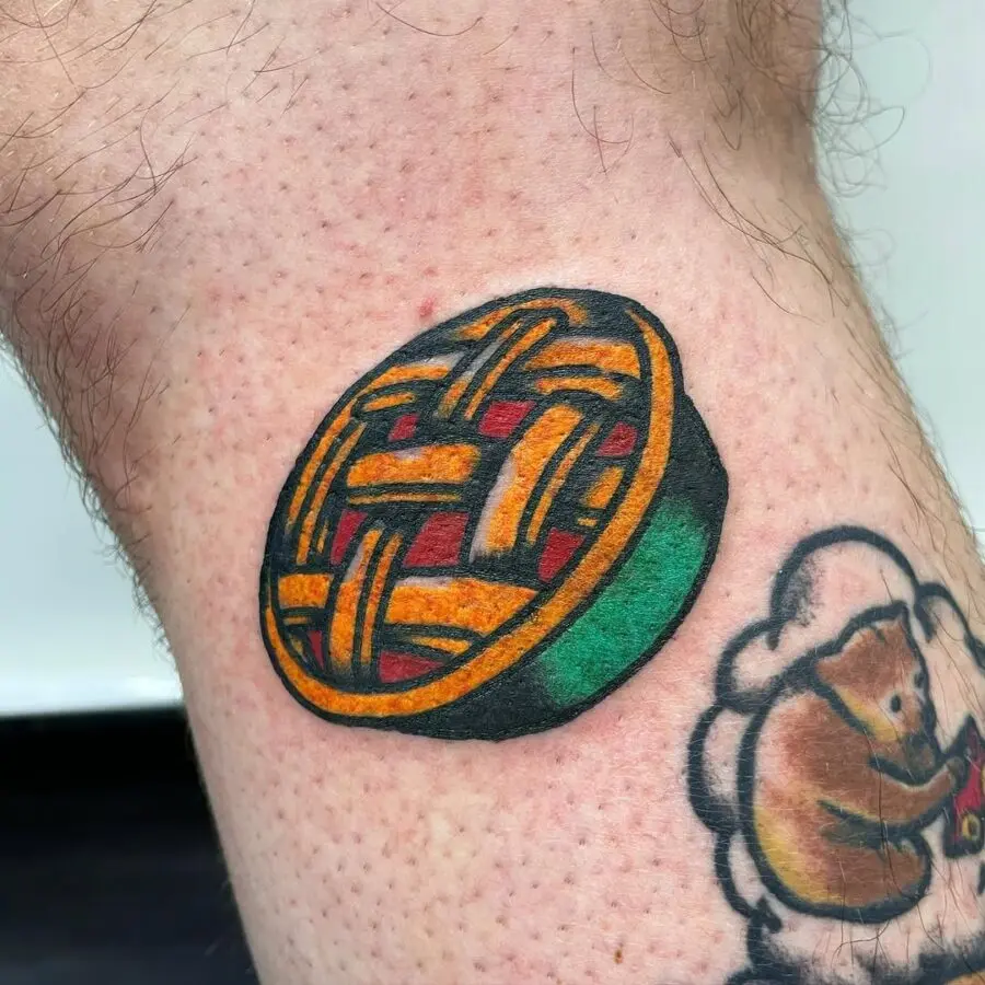 Vibrant pie tattoo on a leg