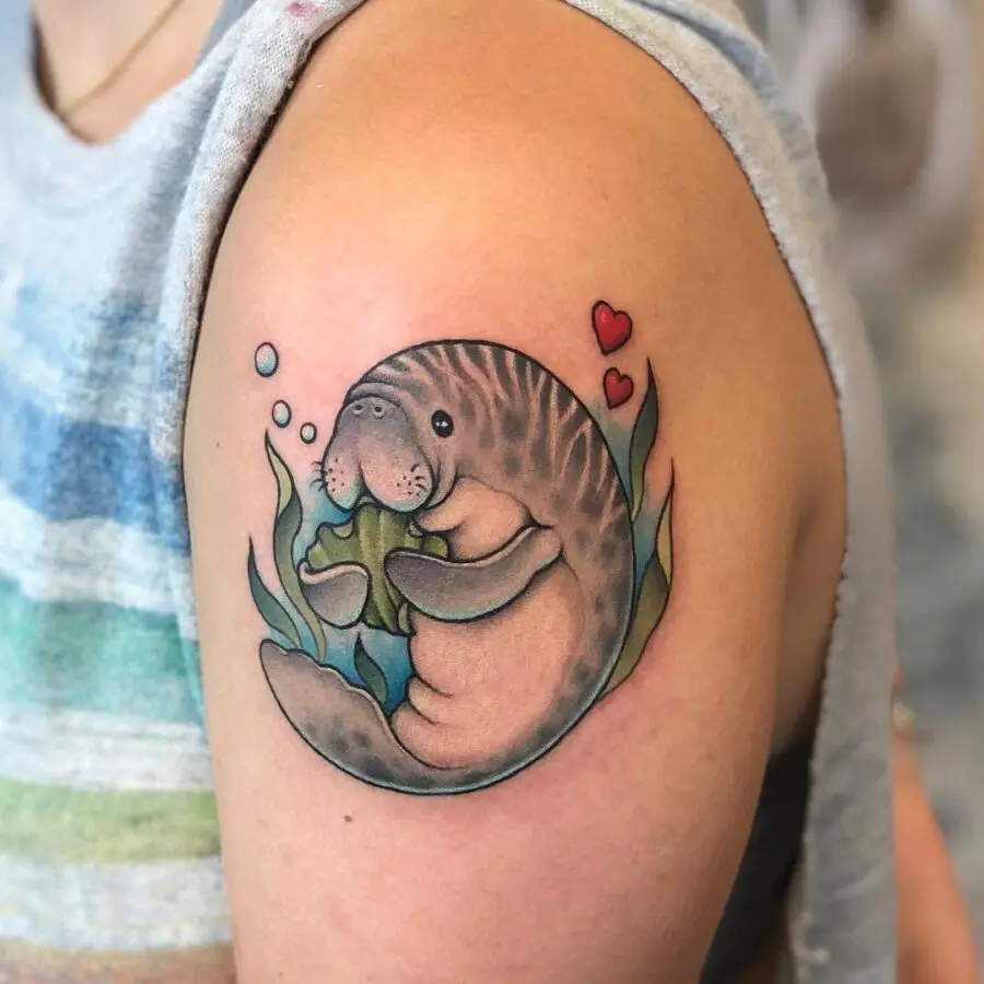 Adorable manatee tattoo with playful elements