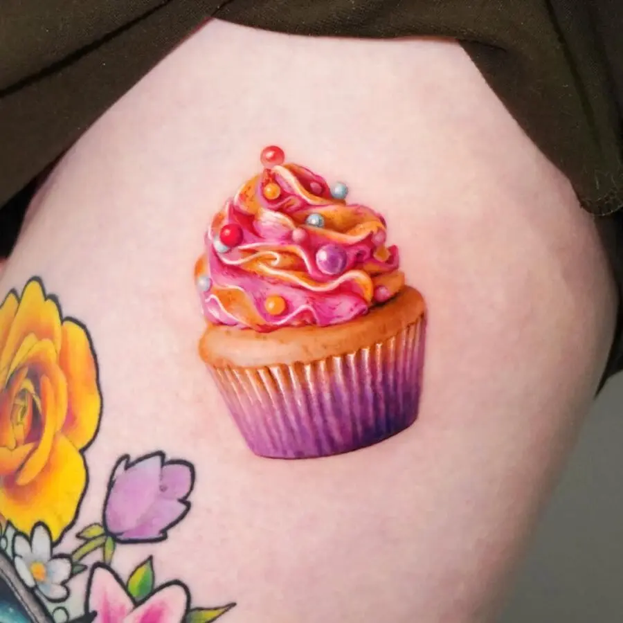 Vibrant cupcake tattoo showcasing sweet creativity