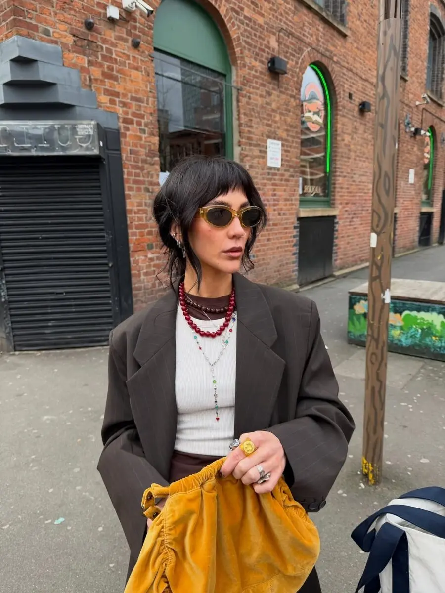 Trendy outfit combining elegance and street style
