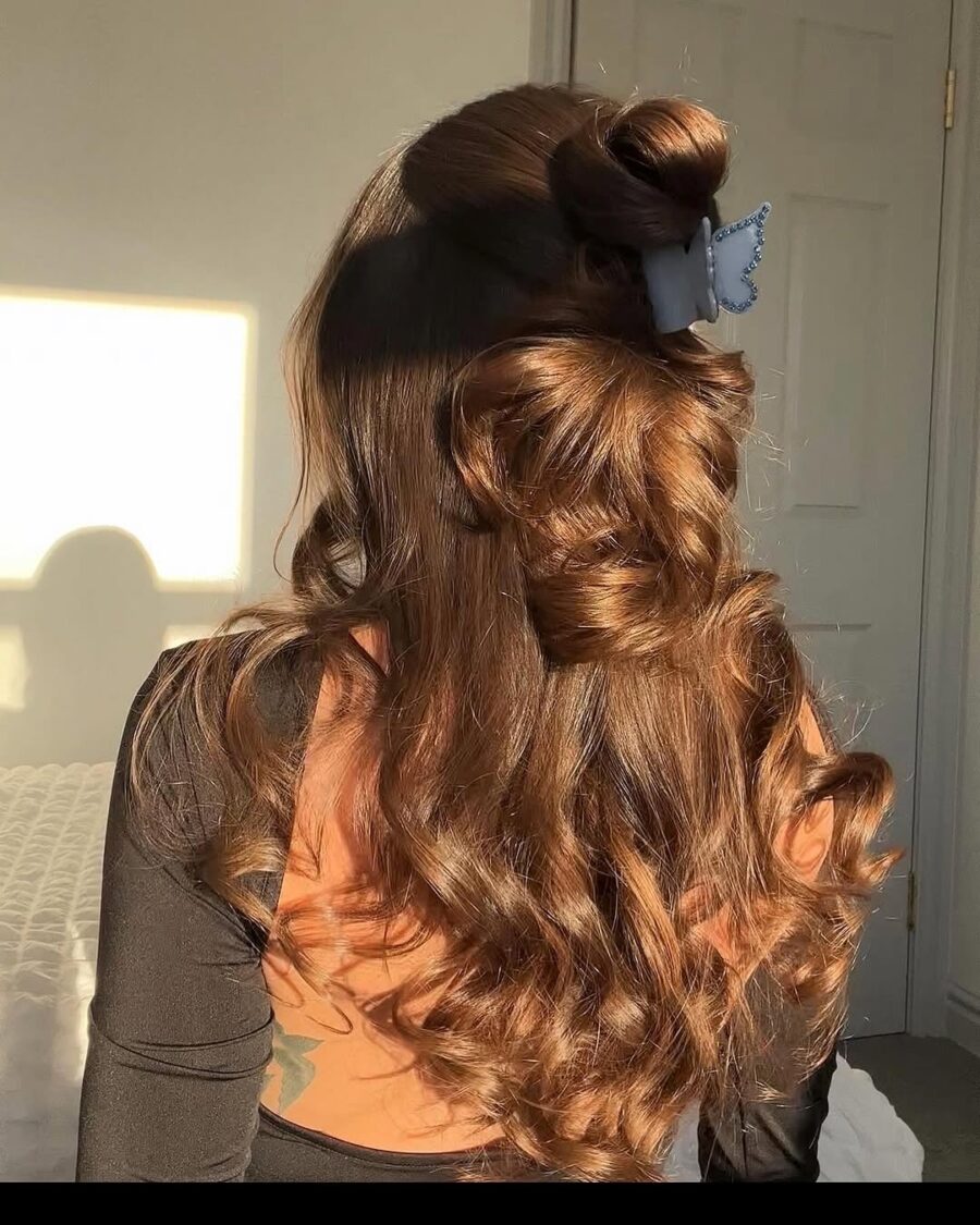 Stylish long curls with a playful bun
