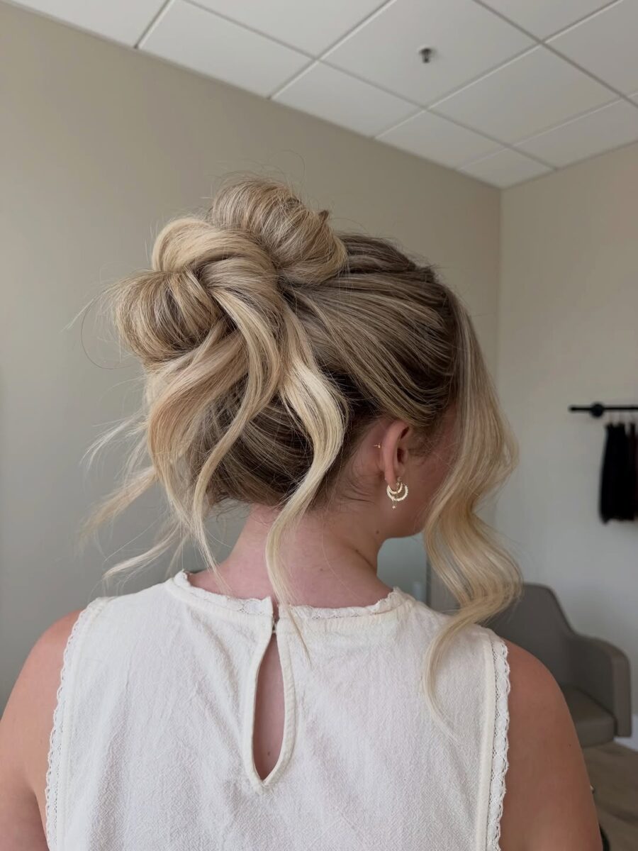Stylish updo with loose curls and flair