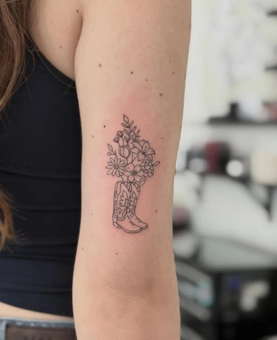 Beautiful floral cowboy boot tattoo design