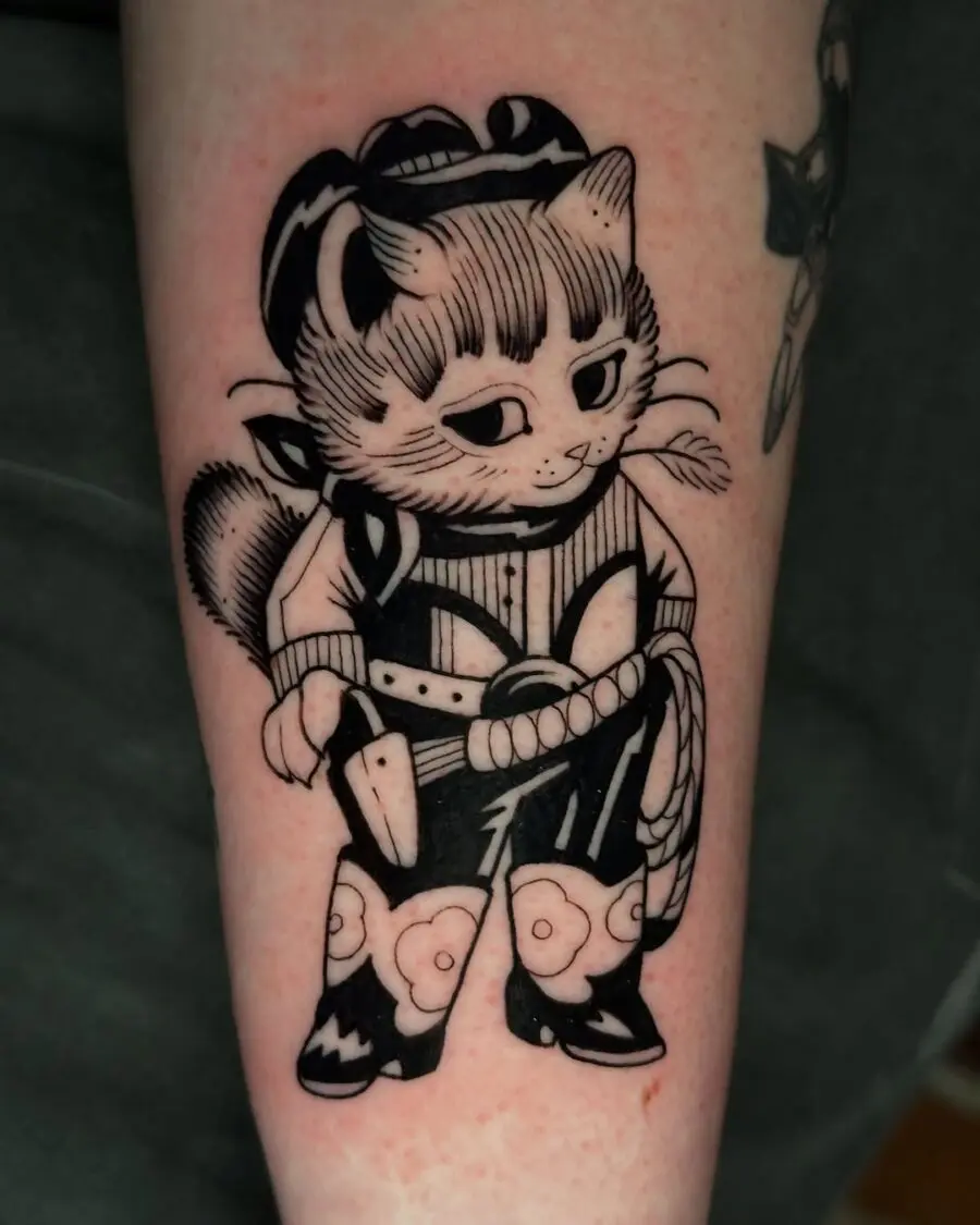Playful farm cat in cowboy attire tattoo