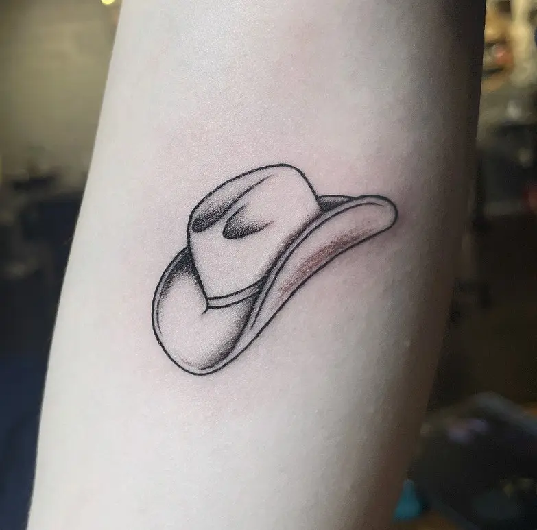 Stylish cowboy hat tattoo with rustic flair