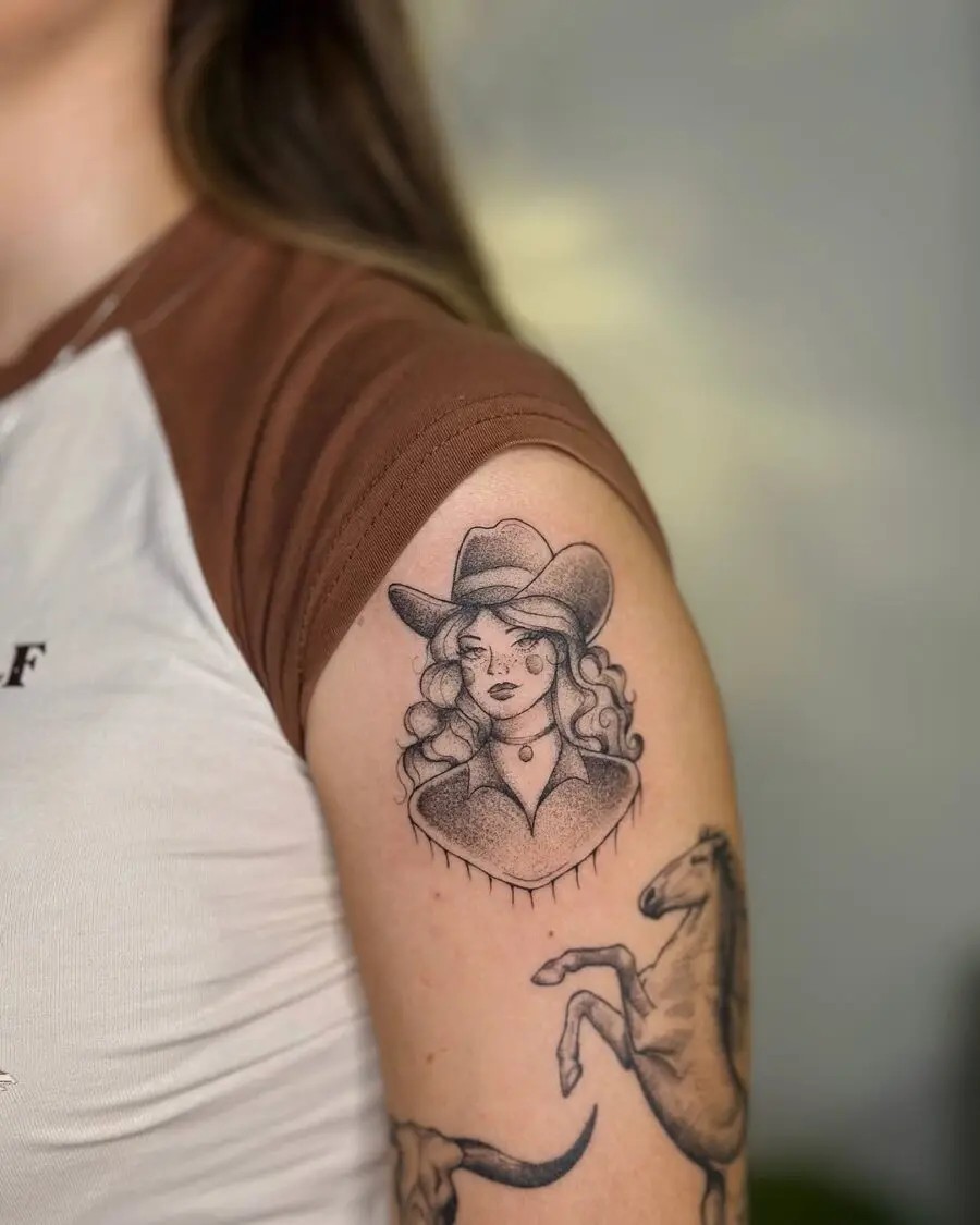 Stylish tattoo showcasing a confident cowgirl portrait