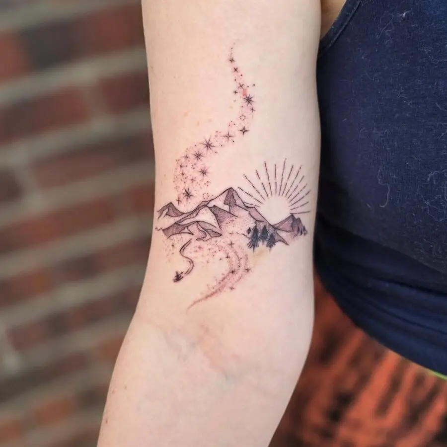 Serene mountain sunset tattoo design