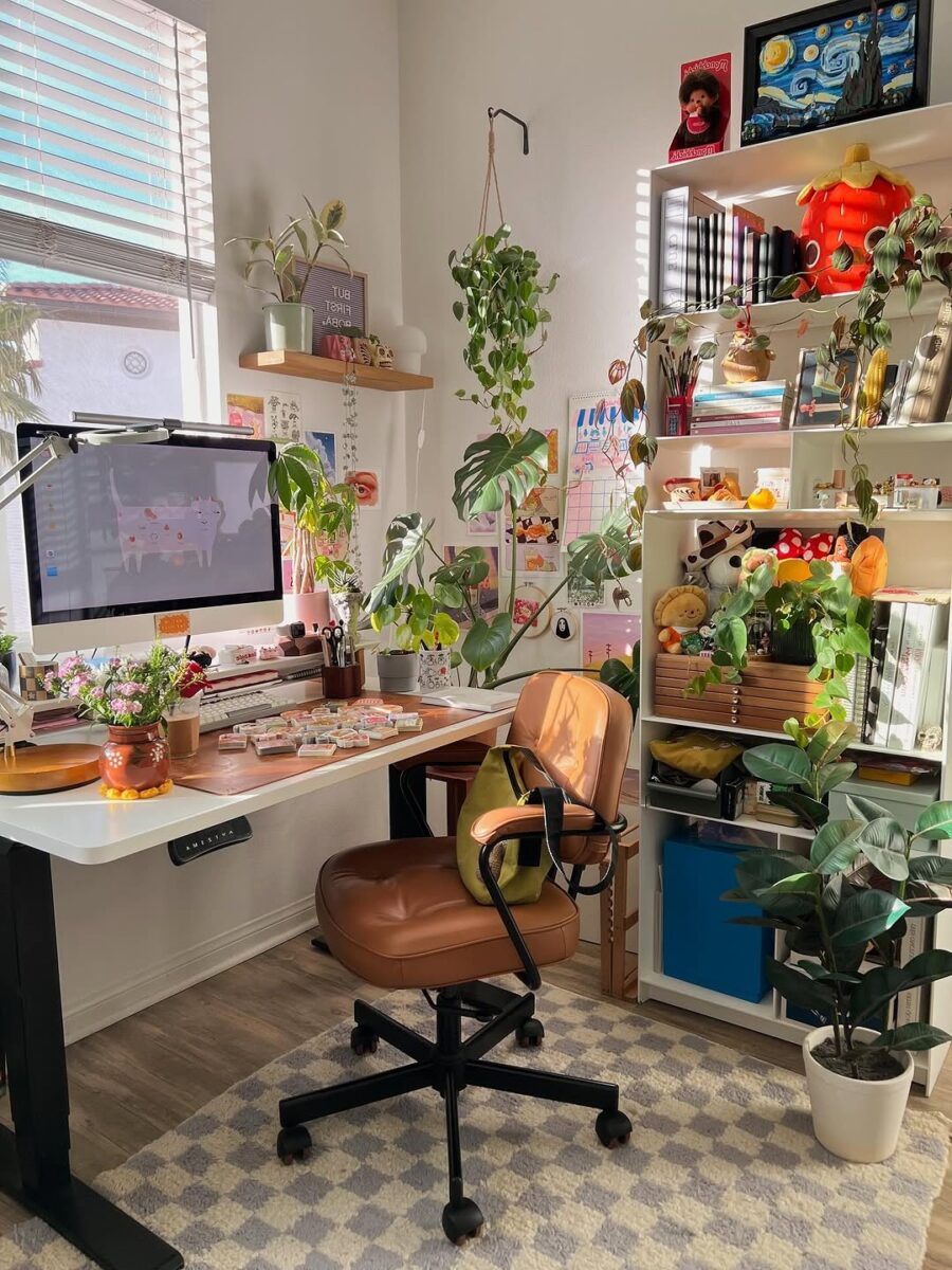 Charming corner desk filled with greenery and warmth