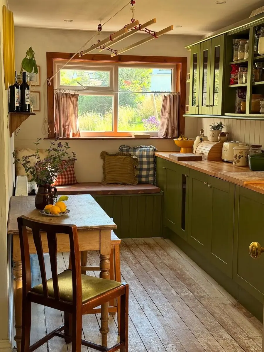 Charming green cottage kitchen with rustic elements