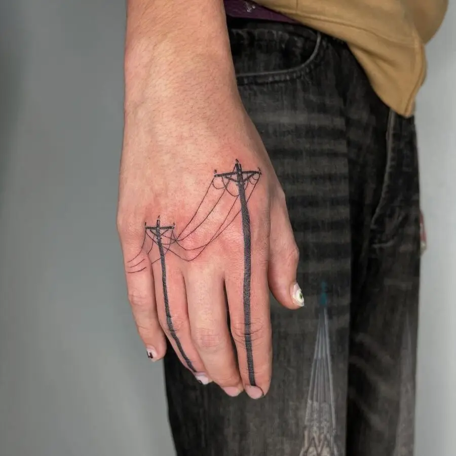 Humorous hand tattoo with power lines