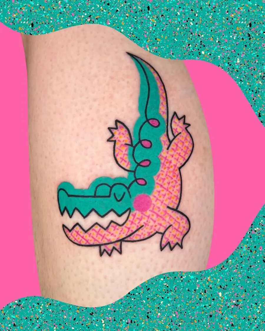 Playful crocodile tattoo bursting with color