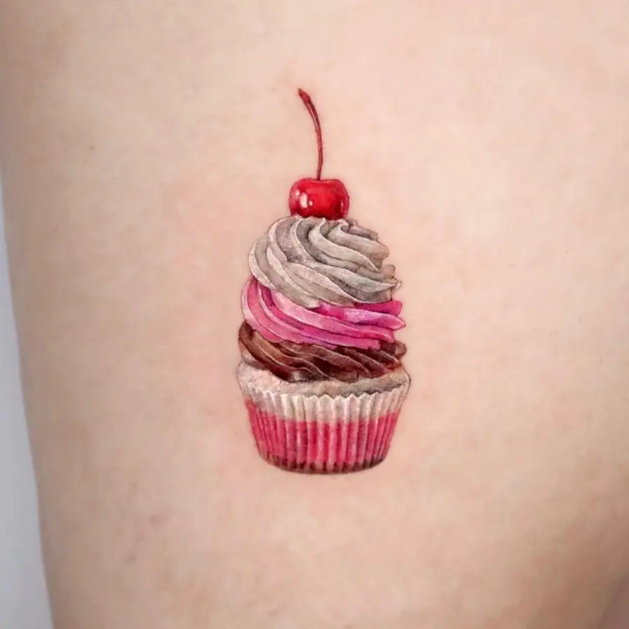Delightful 3D cupcake tattoo with cherry