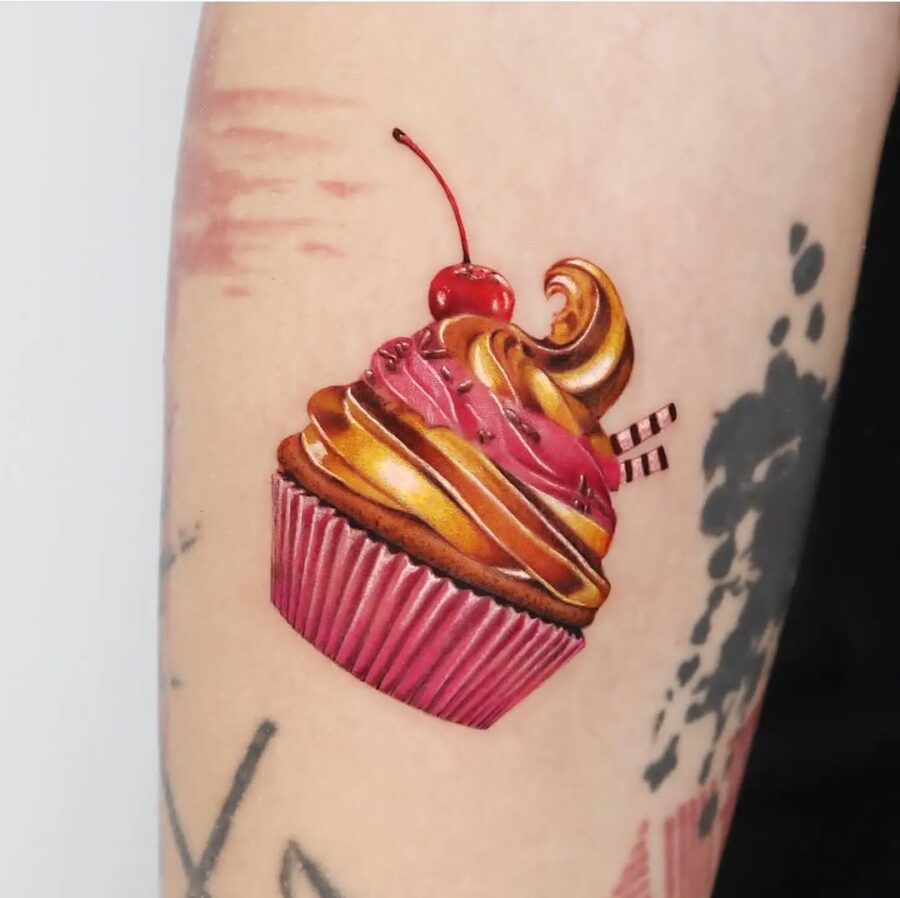 Whimsical cupcake tattoo with cherry on top