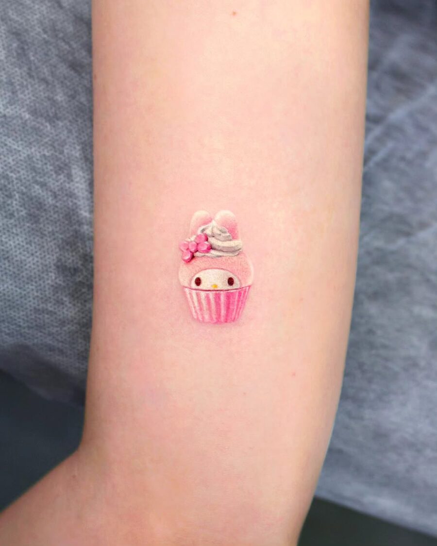 Charming pastel cupcake tattoo with adorable details