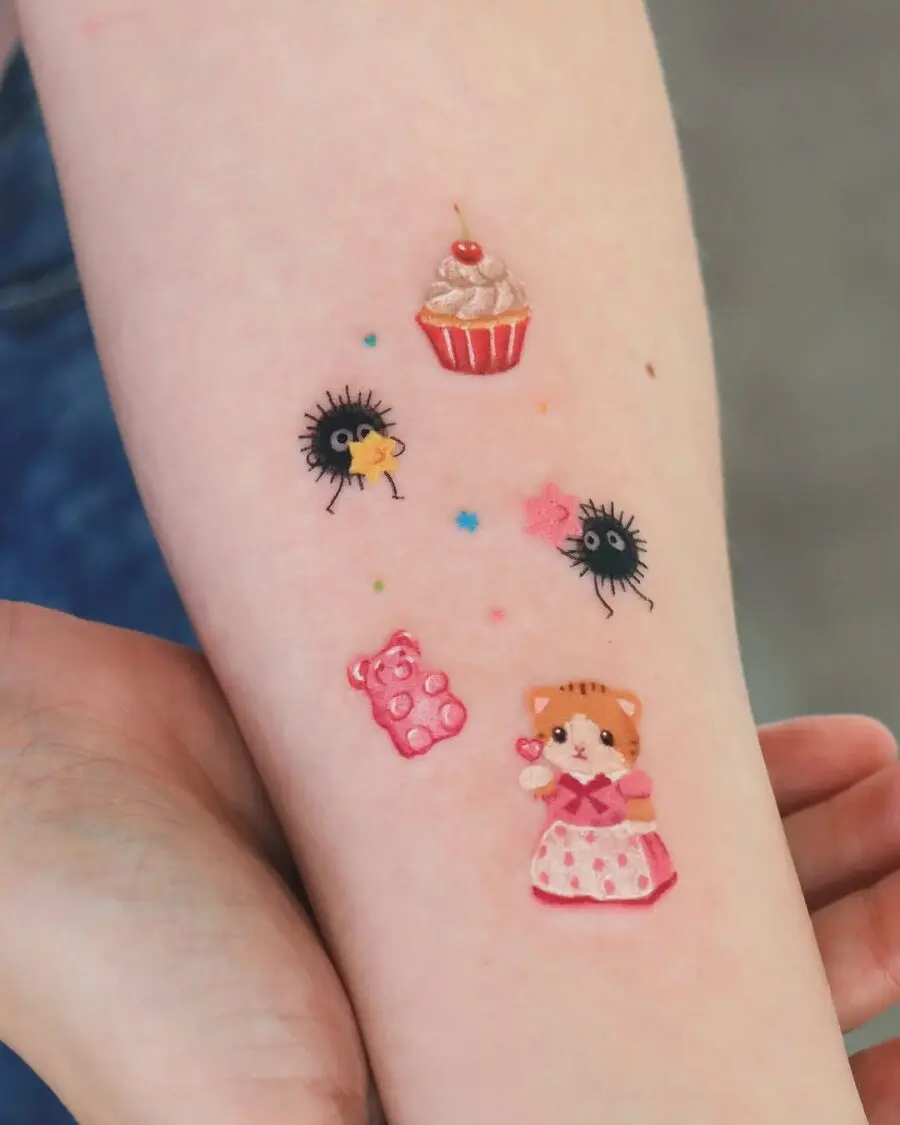 Adorable cupcake tattoo with whimsical characters