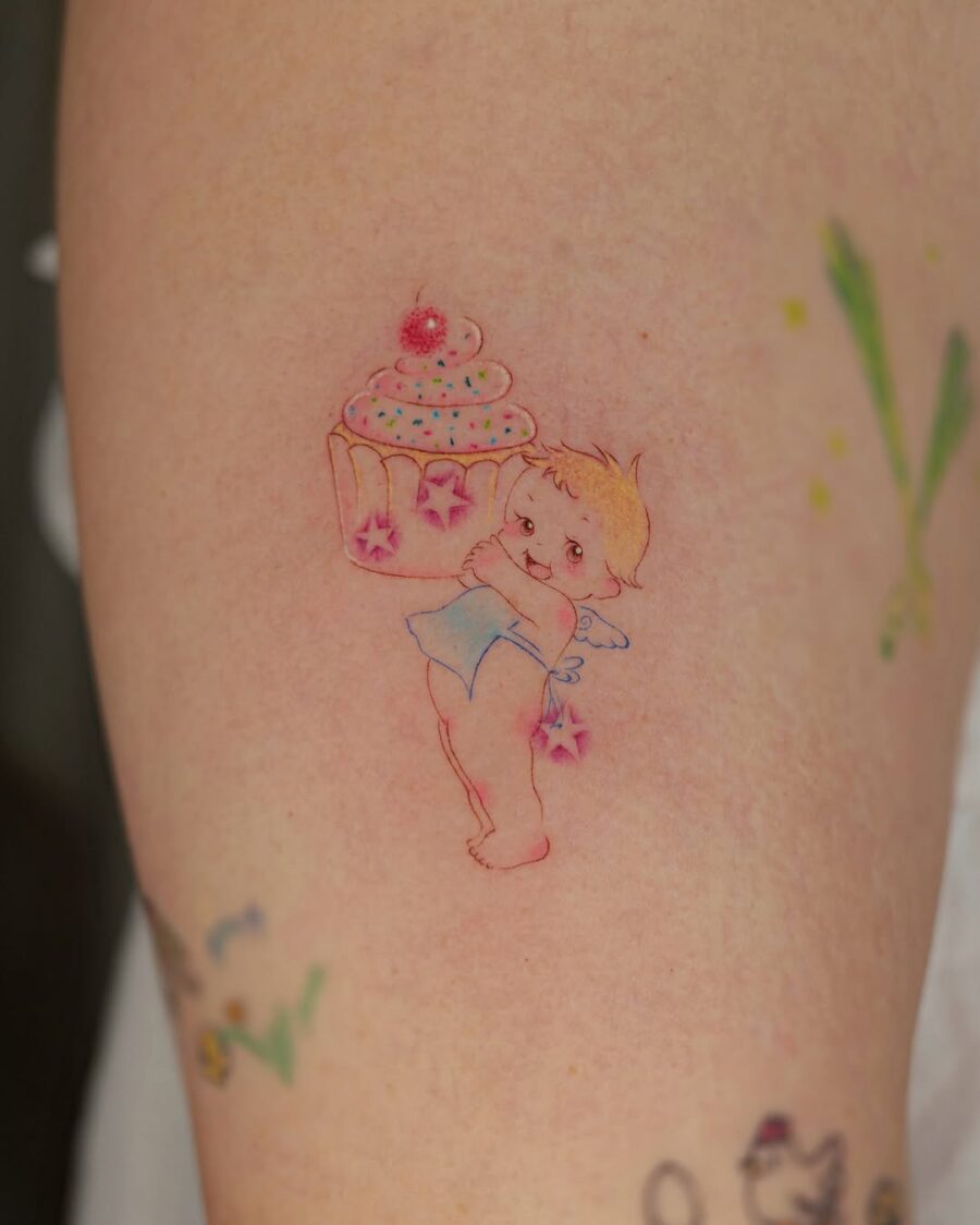 Whimsical angelic cupcake tattoo design
