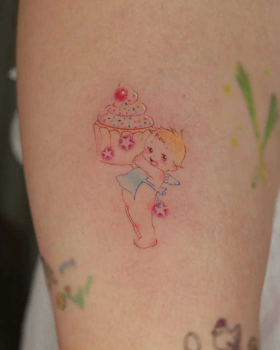 Whimsical angelic cupcake tattoo design