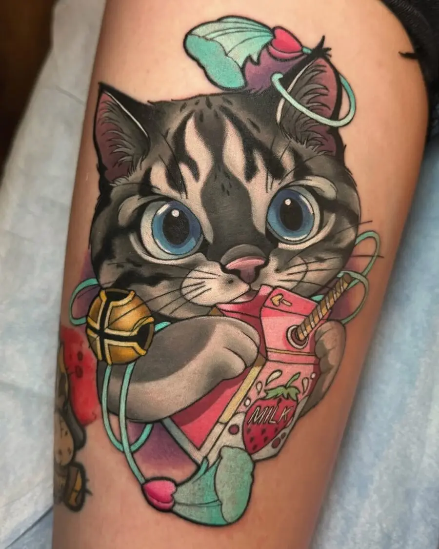 Whimsical cartoon cat tattoo with vibrant colors