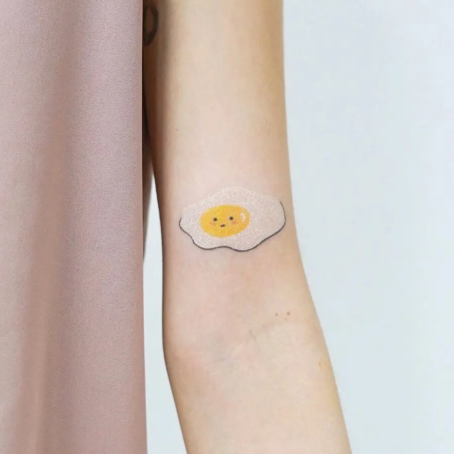 Charming minimalist egg tattoo for playful vibes