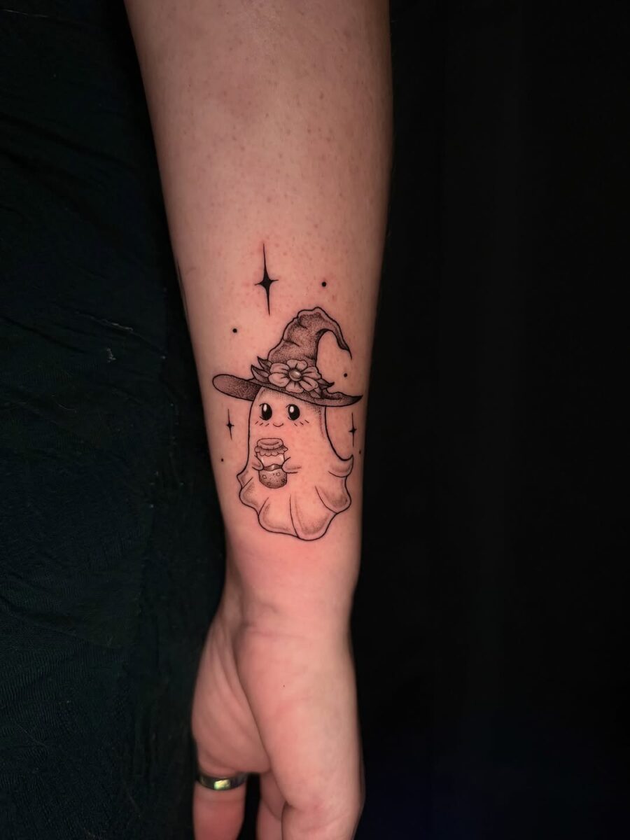 Charming ghost with a witch hat tattoo