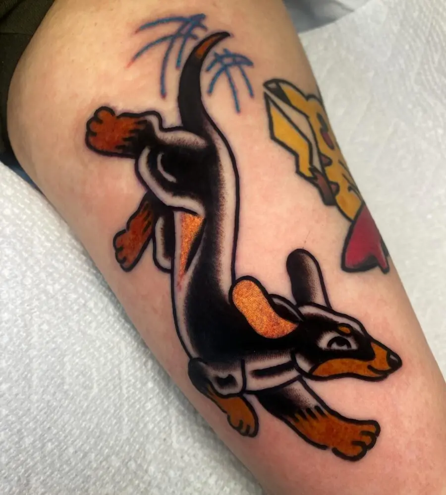 Playful dachshund tattoo in vibrant hues