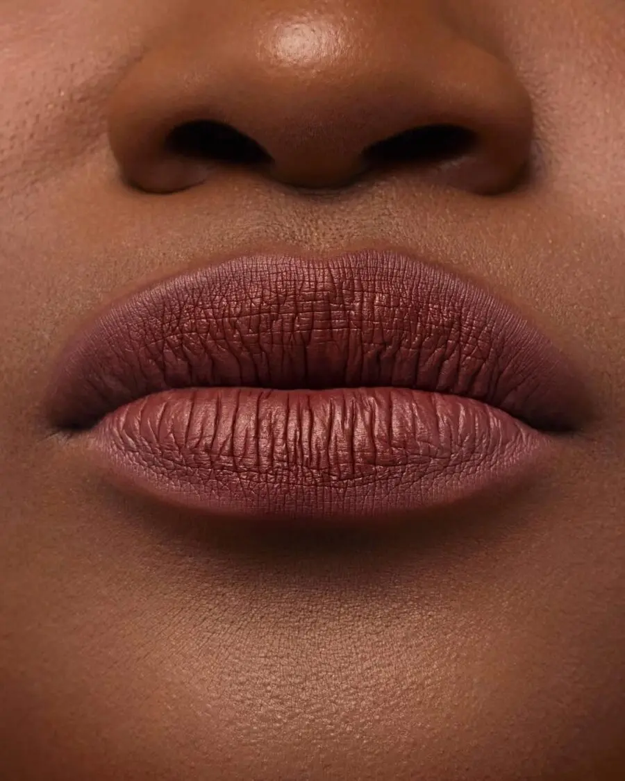Matte nude brown lipstick for dark skin.