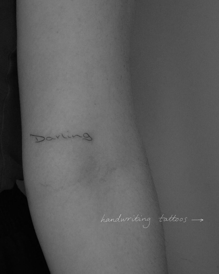 Elegant handwriting tattoo exuding warmth and love