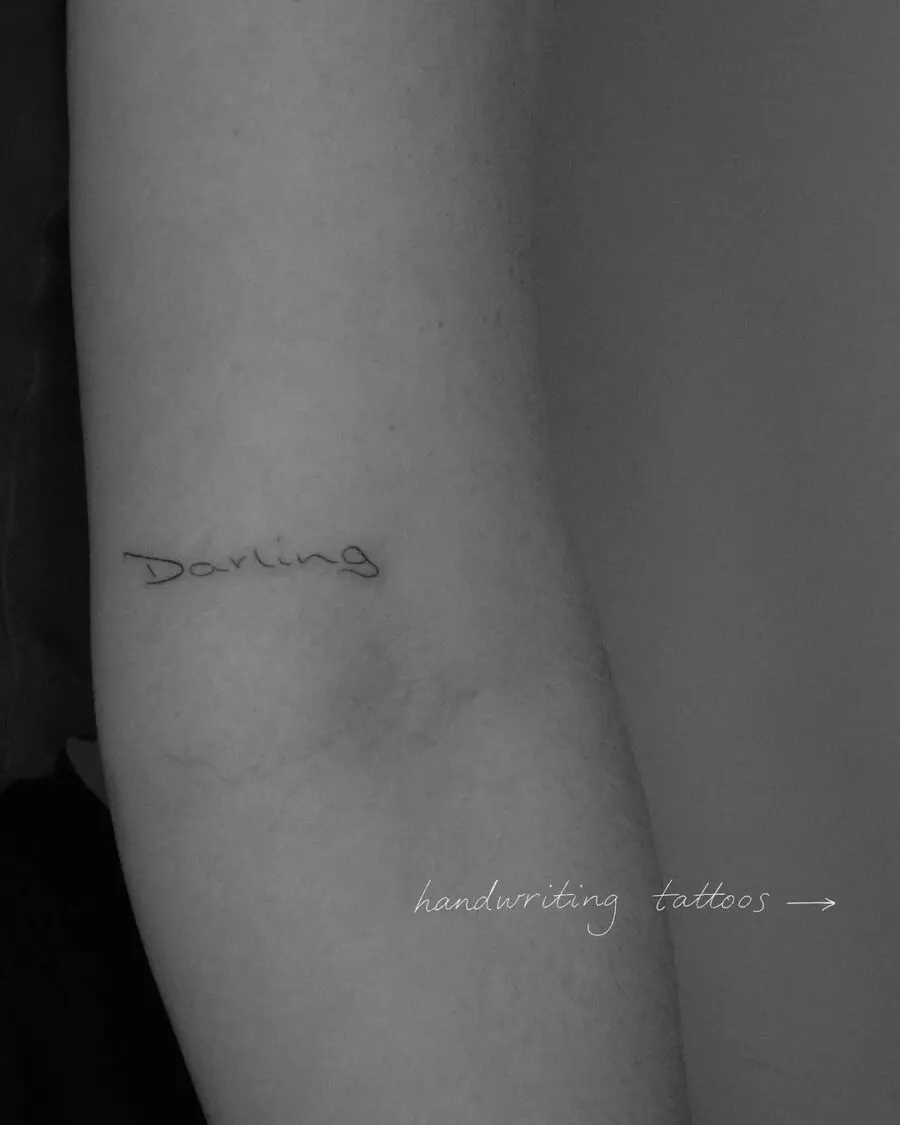 Elegant handwriting tattoo exuding warmth and love