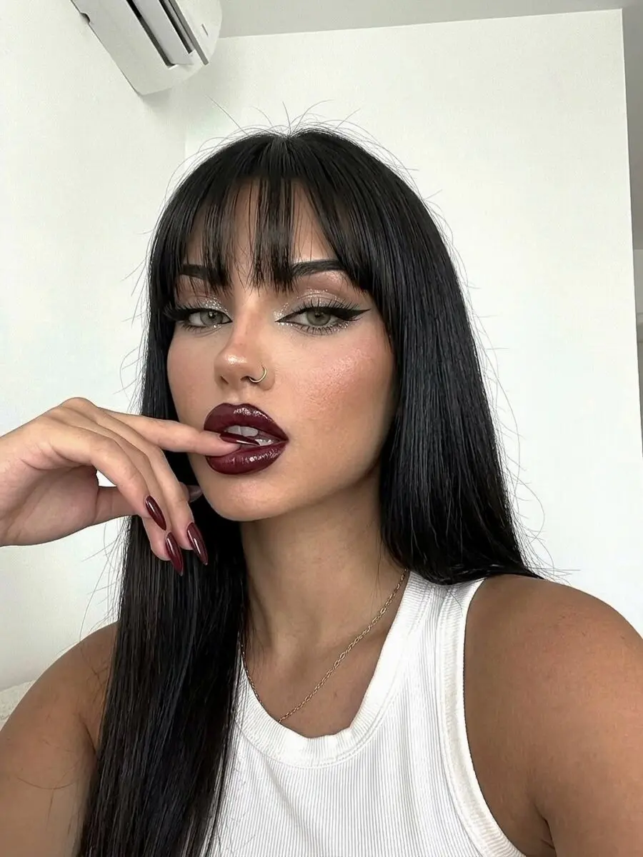 Elegant makeup with bold lips and long hair