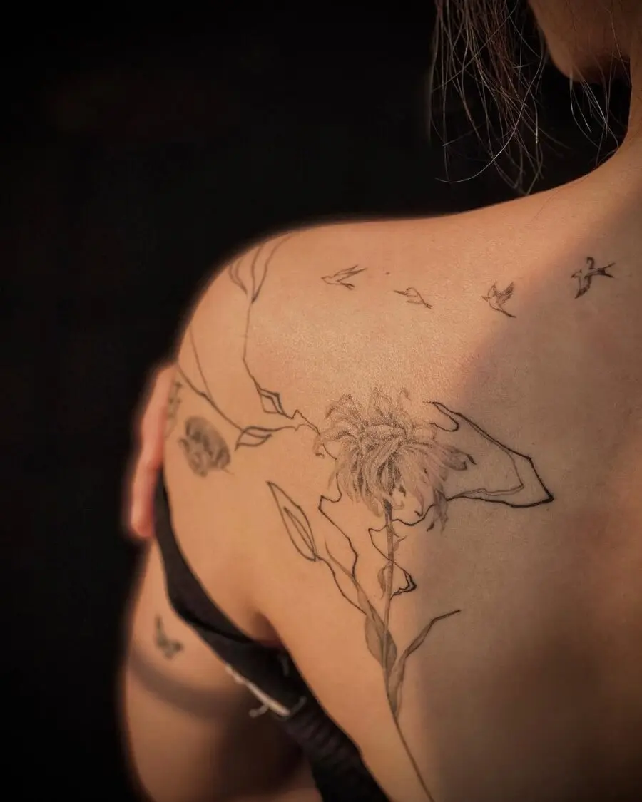 Artistic dead flower tattoo with delicate details