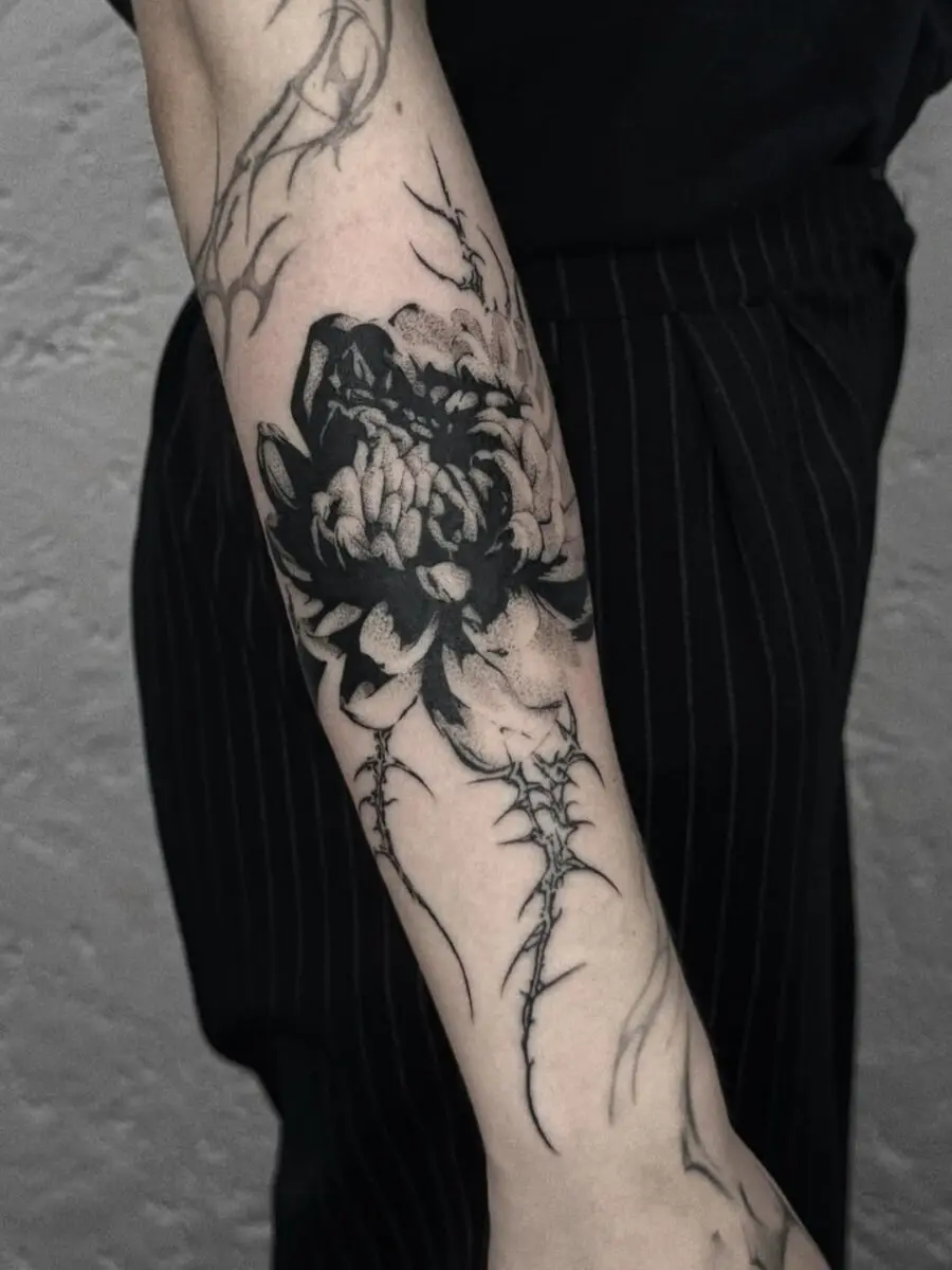 Intricate blackwork dead flower tattoo design