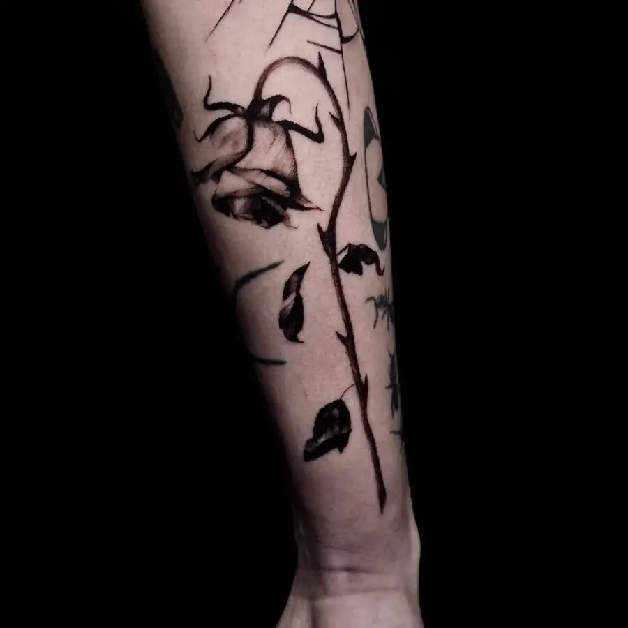 Elegant black and grey dead flower tattoo.