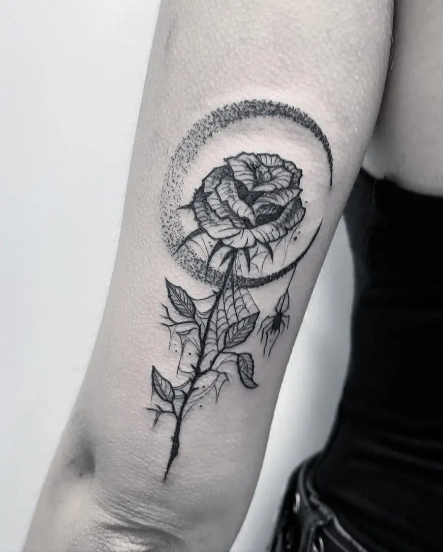 Elegant rose tattoo with moon accents